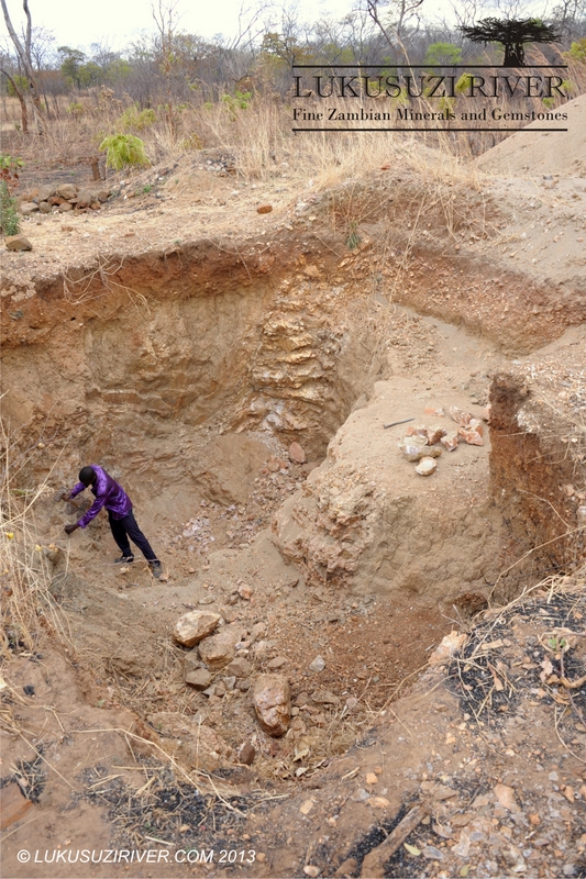 Magodi: The pegmatite was discovered during farming and the pits were dug by Mr. Mbusi on his own.